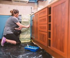 Woman Painting The Cabinet — Glendale, AZ — Top Star Painting Services