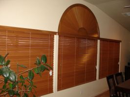 Basswood horizontal blinds and framed fan arch