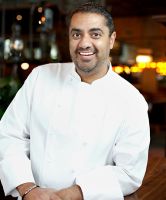 a smiling chef standing in the restaurant